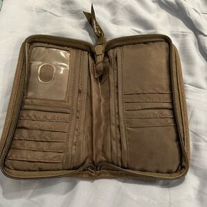 Thirty-one brown quilted wallet.